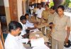 Police personnel cast their votes through postal ballots